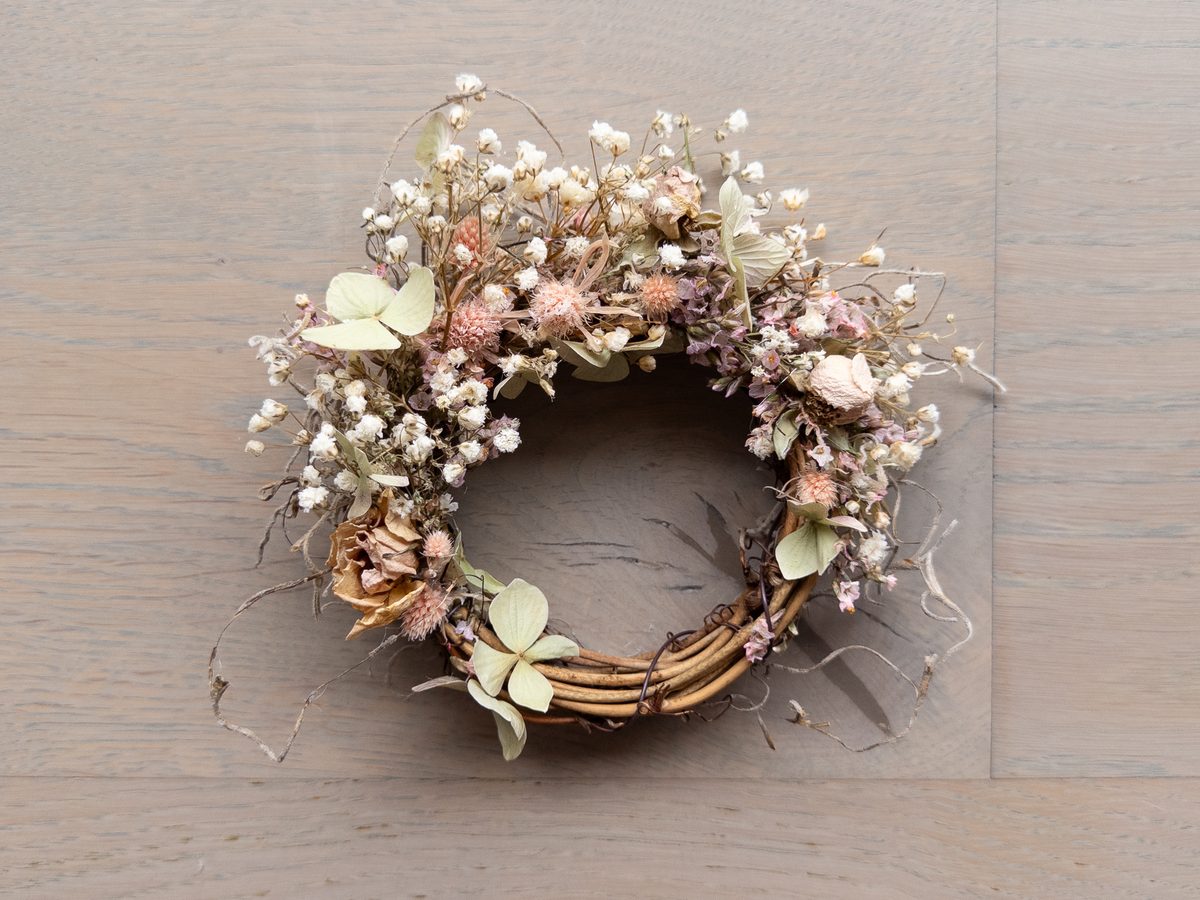 Delicate preserved floral wreath on grapevine base